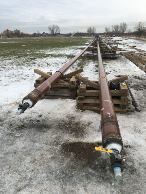 two pipes on snowy ground